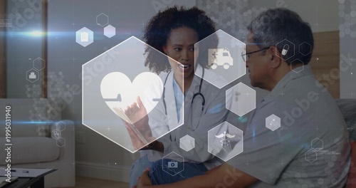 Showing clinician in white coat and stethoscope pointing at digital heart at home, with tablet