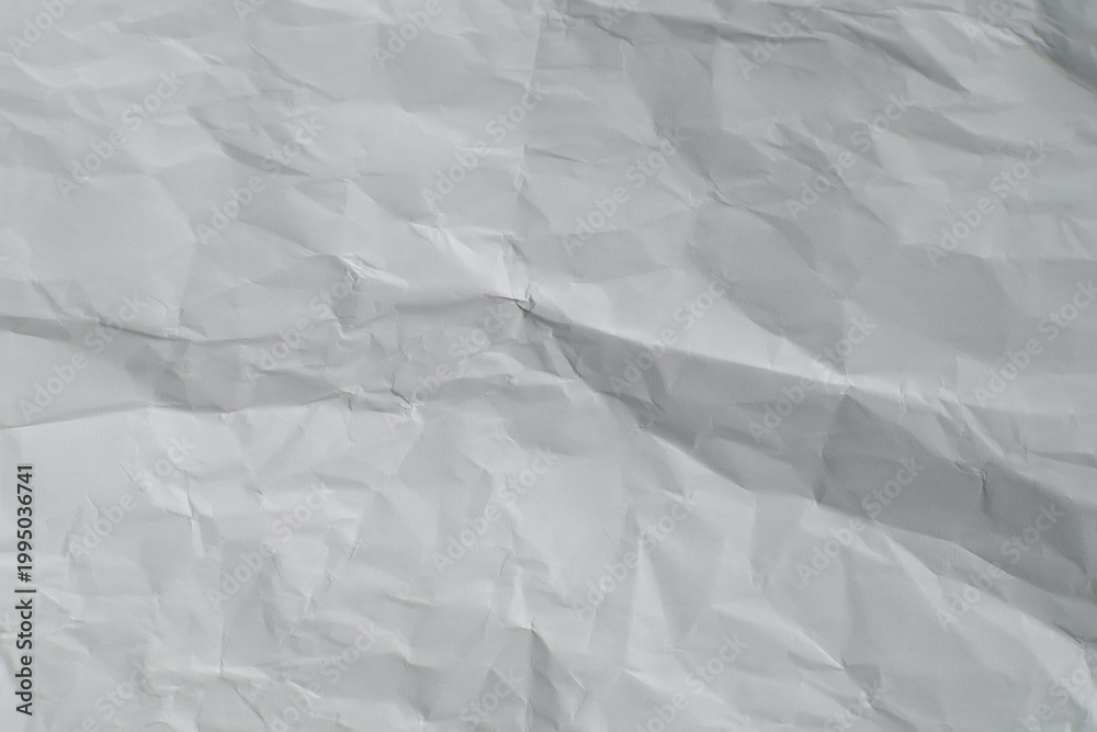 Obraz premium Close up of completely crumpled white paper texture