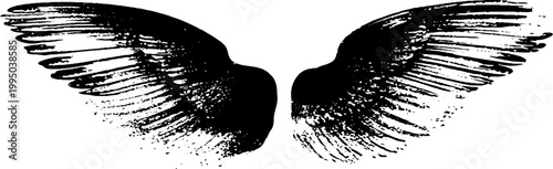 Dramatic black and white angel wings ink silhouette with splatter texture for background and graphic design use in banners posters and wallpaper