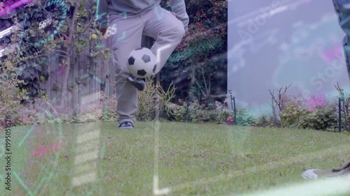 Male juggling soccer ball on lawn, starting instep, practicing control, glitch overlay over legs