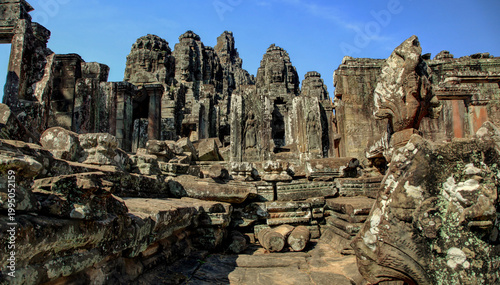 Ancient Khmer Empire Temple Complex at Angkor Wat, Cambodia - Awe-Inspiring Historical Ruins with Lush Greenery and Clear Sky