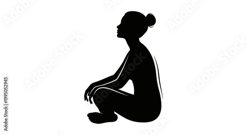 Silhouette of a woman seated in a meditative peaceful pose