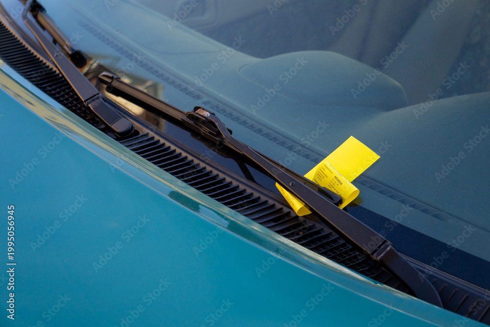 Fototapeta premium Oslo Parking Ticket Violation Fine Yellow Citation Under Windshield Wiper Traffic Enforcement Urban Regulation Vehicle Compliance Penalty Notice Parking Law Municipal Fine Road Safety