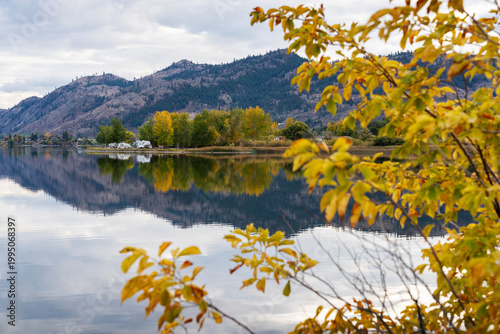 Lakeside Camping Reflection Osoyoos. Campers on a quiet point on Osoyoos Lake, British Columbia, Canada.

