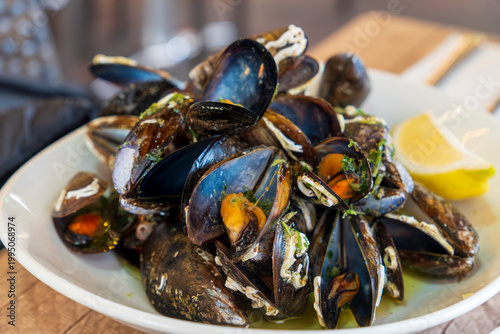 boiled mussels with lemon garlic and olive oil spanish appetizer in restaurant