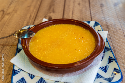 Tasty dessert catalana crema served with caramel crust served with spoon