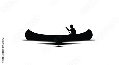 Silhouette of a person canoeing on calm water a peaceful scene