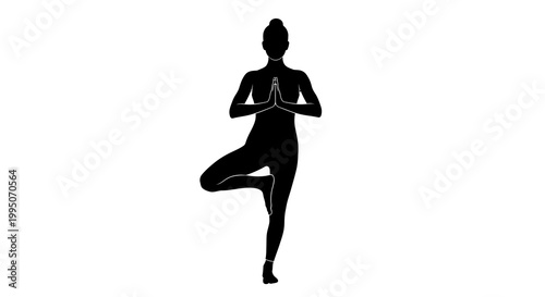 Silhouette of a woman practicing yoga in a tree pose