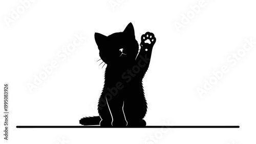 Black kitten silhouette sitting and waving with paw raised