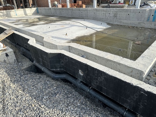 Construction site with unfinished swimming pool outdoors, closeup