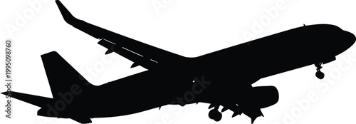 Black and white of a bird in flight, wings spread wide silhouette