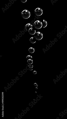 Vertical realistic air bubbles floating on transparent alpha channel background.