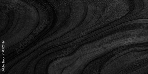 Abstract dark black wood grain texture background with elegant wavy natural patterns for wallpaper. professional overhead shot of a dark charcoal or black wood surface featuring organic, flowing grain