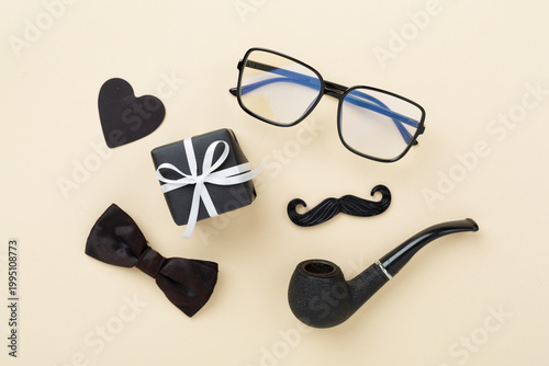 Happy Father's Day accessories on color background, top view