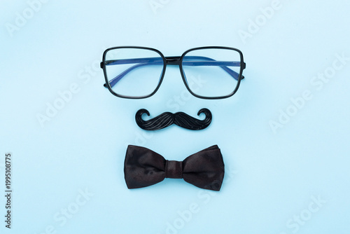 Happy Father's Day accessories on color background, top view