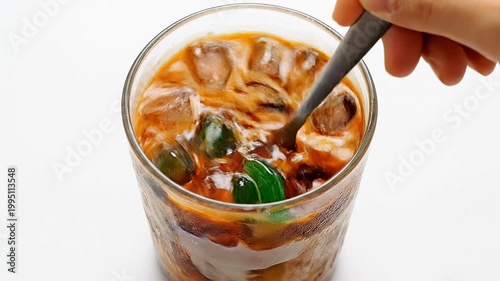 Making Es Cendol - A Refreshing Indonesian Dessert with Green Jelly and Coconut Milk.