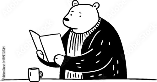 Bear reading book with mug on table surface near counter