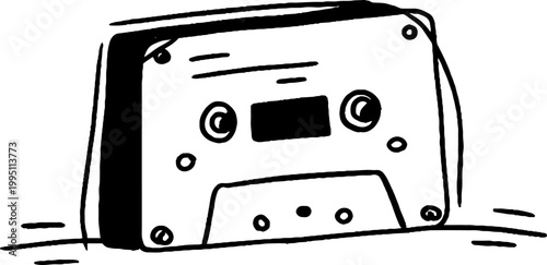 Cassette tape resting on flat surface with subtle shadow