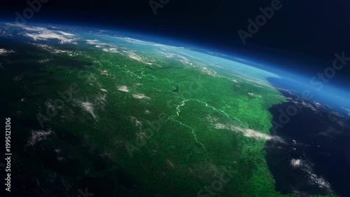 Aerial view of Earth showcasing lush green landscapes and blue oceans. Represents the beauty of our planet and the importance of environmental conservation