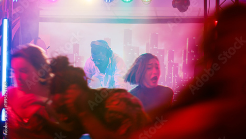 Photos Party interrupted by police officers, cheeful people at nightclub running away from law enforcement