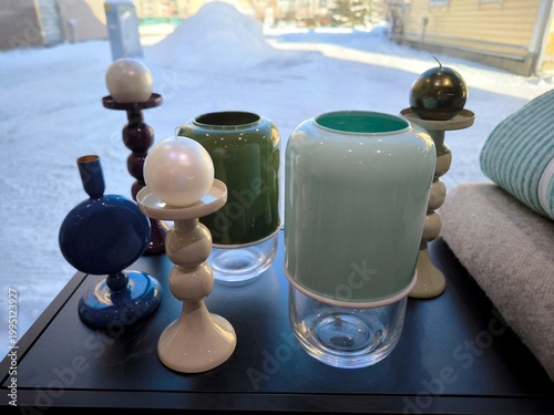 Принти на полотні Modern designer candlesticks and vases by the window