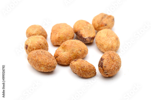 Dried peanuts in closeup on white