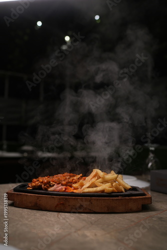 Obraz na plátně Sizzling Steak and Fries Platter
