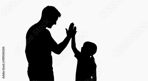 A silhouette of a man and a child giving each other a high five