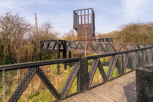 The Tur Viewing Platform at Cuningar Loop, Scotland, UK, is a landmark viewing platform and lookout tower providing elevated, treetop views across the woodland park, the River Clyde, the Hope statue. 