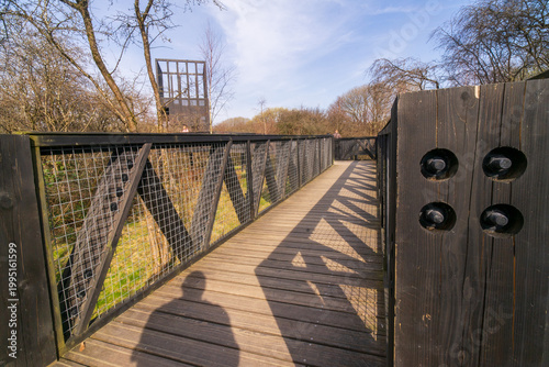 The Tur Viewing Platform at Cuningar Loop, Scotland, UK, is a landmark viewing platform and lookout tower providing elevated, treetop views across the woodland park, the River Clyde, the Hope statue. 