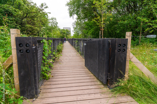 The Tur Viewing Platform at Cuningar Loop, Scotland, UK, is a landmark viewing platform and lookout tower providing elevated, treetop views across the woodland park, the River Clyde, the Hope statue. 