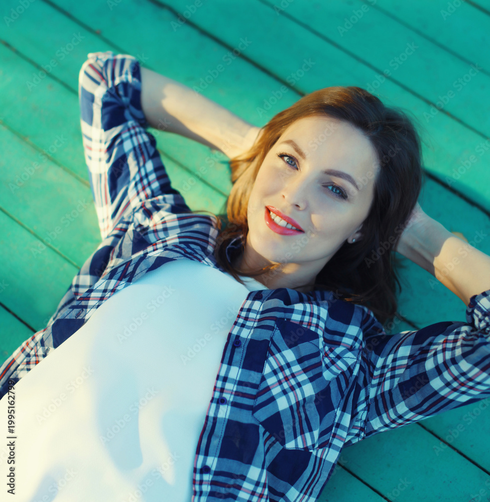 Fototapeta premium Beautiful happy young woman relaxing on a summer day