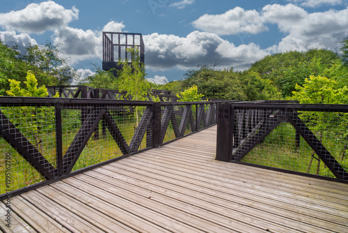 The Tur Viewing Platform at Cuningar Loop, Scotland, UK, is a landmark viewing platform and lookout tower providing elevated, treetop views across the woodland park, the River Clyde, the Hope statue. 
