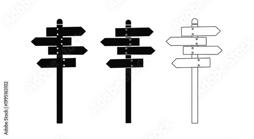 Three directional signposts in varying styles a stark silhouette