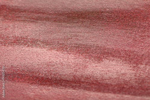 
Close-up of white paint strokes on red background