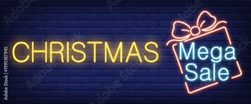 Christmas mega sale neon sign on brick wall background with gift icon  christmas shopping concept