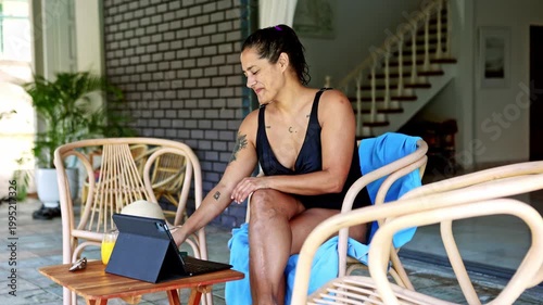 Smiling woman working remotely on vacation outdoors