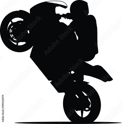 Black silhouette of a person riding a sport motorcycle doing a wheelie stunt