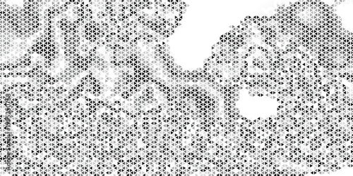 Macro close-up of black halftone dots on white paper forming a dense geometric mosaic of triangles and diamond shapes, with varied dot density, sharp edges, and visible print grain.
