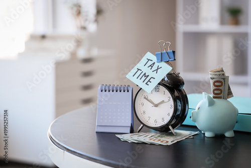 Alarm clock with text TAX T...