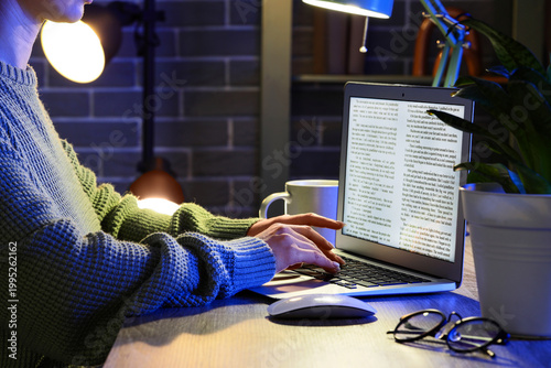 Female writer editing text ...