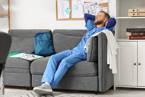 Handsome medical intern sit...
