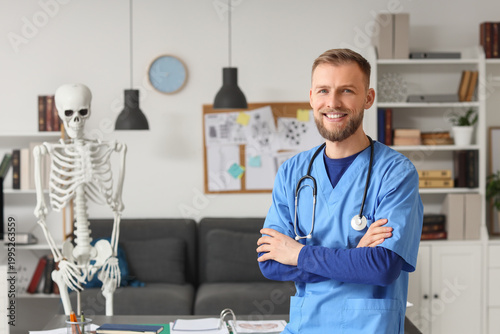 Portrait of handsome medical intern in clinic
