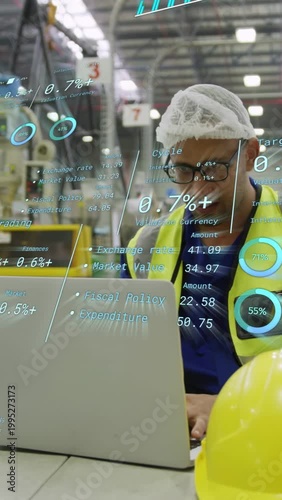 Vertical video: Tech at laptop in plant checking metrics while AR charts appearing, yellow hard hat