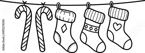 Hand drawn christmas candy canes and stockings hanging on a line