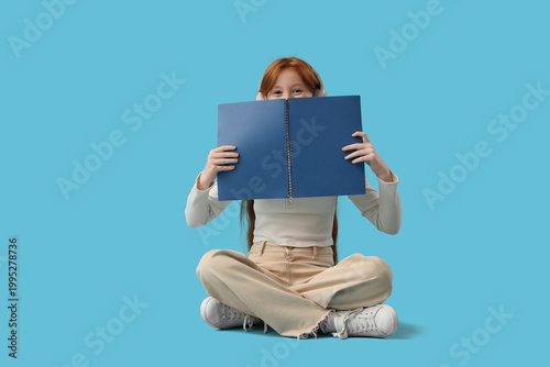 Teenage redhead girl with n...