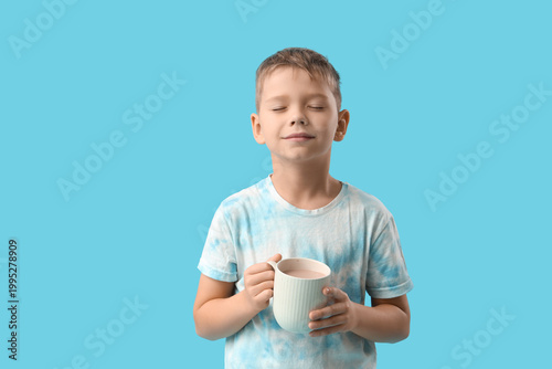 Cute little boy with cup of...