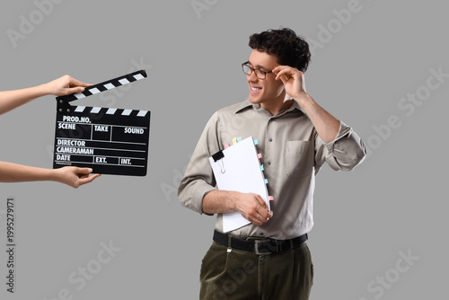 Male screenwriter holding s...