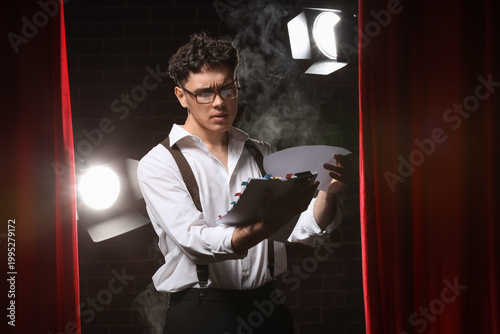 Male screenwriter reading s...