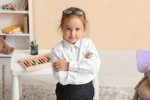 Cute little happy teacher i...